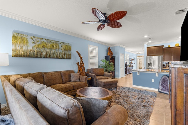 5220 Sunshine Dr, Wildwood, FL 34785 - living area with baseboards, recessed lighting, a ceiling fan, crown molding, and visible vents