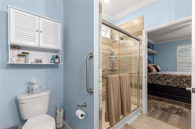 5220 Sunshine Dr, Wildwood, FL 34785 - bathroom featuring toilet, crown molding, a stall shower, and wood finished floors