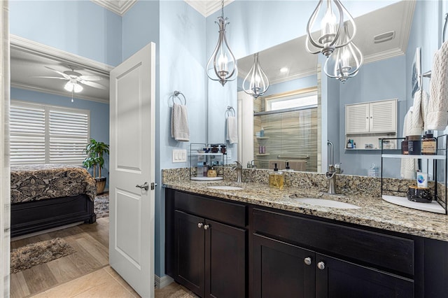 5220 Sunshine Dr, Wildwood, FL 34785 - ensuite bathroom with a sink, ornamental molding, ceiling fan, and a shower stall