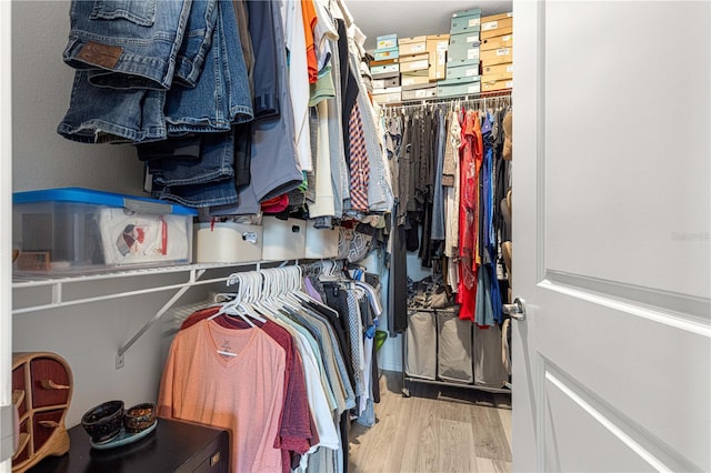5220 Sunshine Dr, Wildwood, FL 34785 - walk in closet with wood finished floors