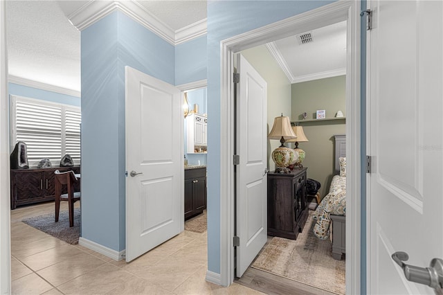5220 Sunshine Dr, Wildwood, FL 34785 - corridor featuring light tile patterned floors, baseboards, ornamental molding, and visible vents