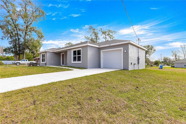 view of front of house with driveway, stucco siding, a garage, and a front lawn