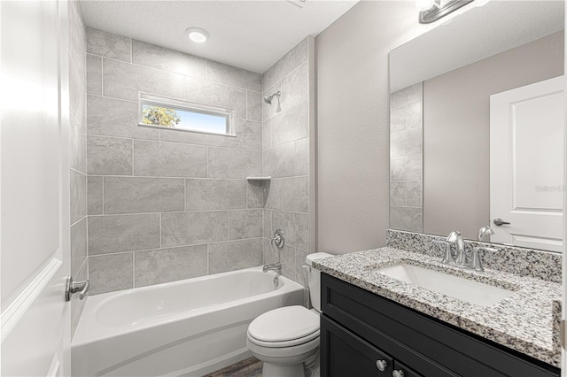 full bath with toilet, vanity, and  shower combination