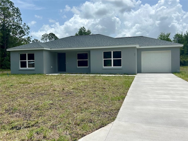 87 Guava Pass Dr, Ocklawaha, FL 32179 - single story home featuring stucco siding, an attached garage, driveway, a front yard, and a shingled roof