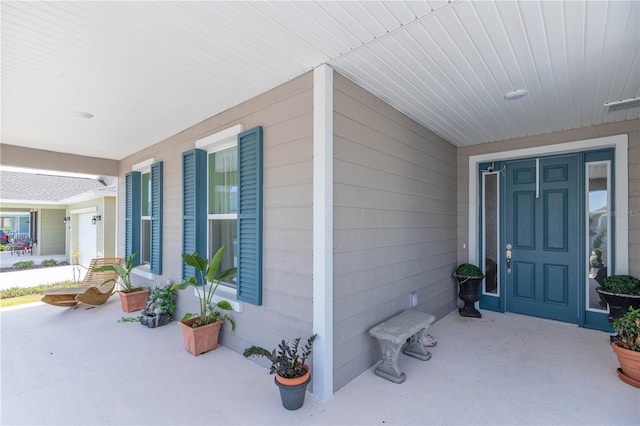 property entrance with visible vents and covered porch