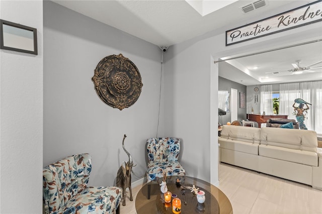 interior space featuring visible vents and a ceiling fan