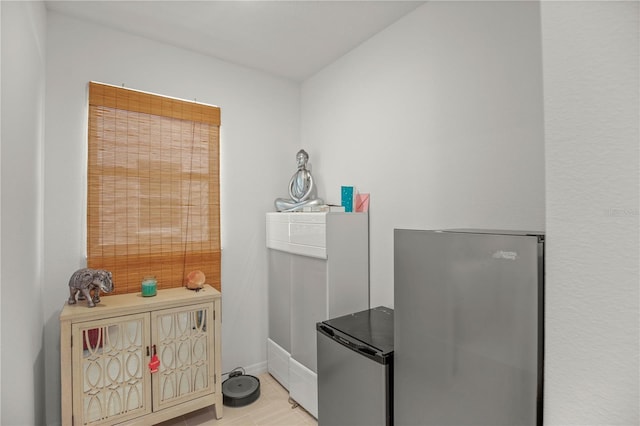 interior space featuring baseboards and light tile patterned flooring