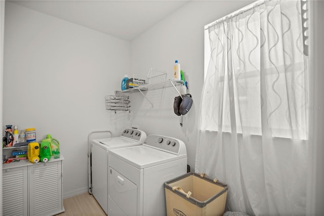 washroom featuring washer and clothes dryer and laundry area