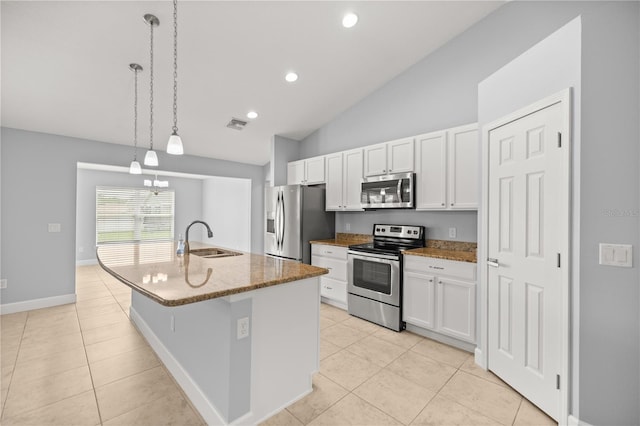 kitchen featuring a sink, light tile patterned floors, appliances with stainless steel finishes, and white cabinetry
