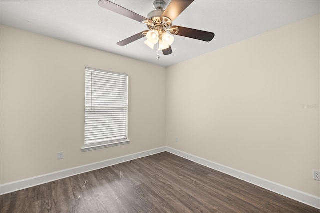 unfurnished room featuring baseboards, a ceiling fan, and dark wood-style floors