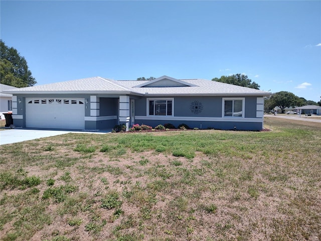 10315 SW 62nd Terrace Rd, Ocala, FL 34476 - ranch-style home with a garage, stucco siding, a front lawn, and driveway