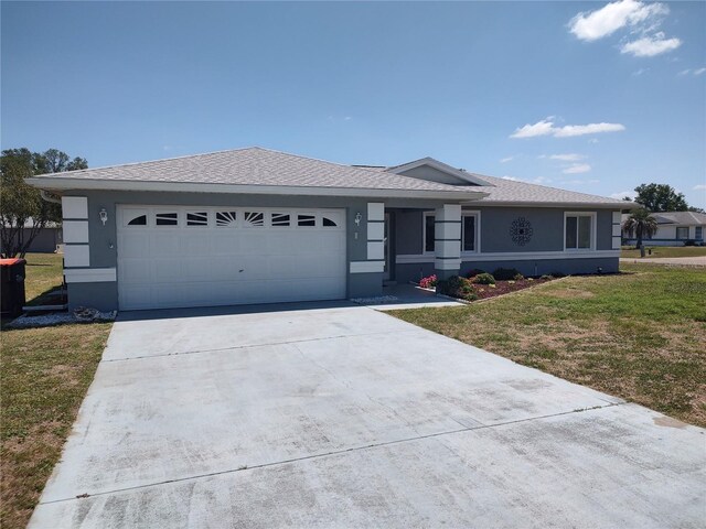10315 SW 62nd Terrace Rd, Ocala, FL 34476 - ranch-style home with driveway, an attached garage, a front lawn, and stucco siding