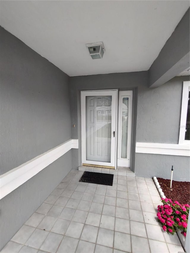 10315 SW 62nd Terrace Rd, Ocala, FL 34476 - view of exterior entry with stucco siding