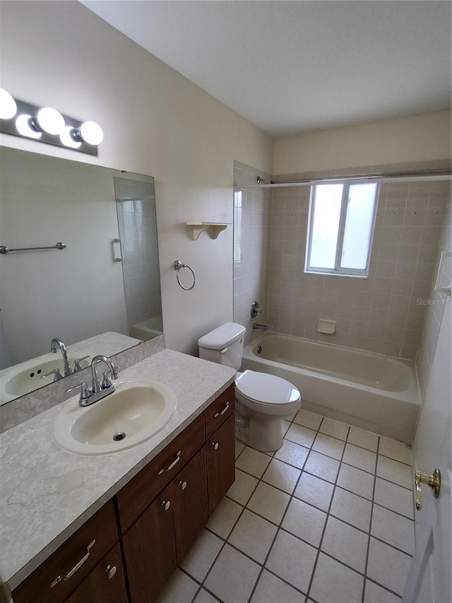 10315 SW 62nd Terrace Rd, Ocala, FL 34476 - bathroom featuring tile patterned flooring, vanity, washtub / shower combination, and toilet