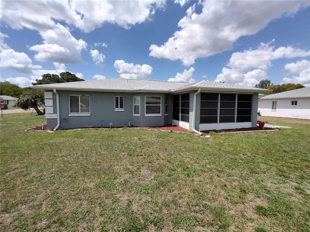 10315 SW 62nd Terrace Rd, Ocala, FL 34476 - back of house featuring a sunroom, a lawn, and stucco siding