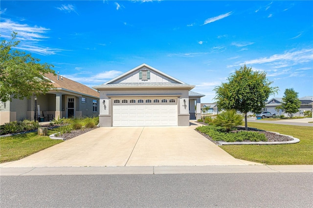 single story home with driveway, a front yard, and stucco siding