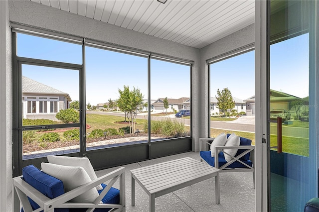 sunroom / solarium with a residential view