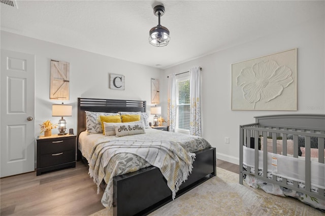 77 Locust Dr, Ocala, FL 34472 - bedroom featuring wood finished floors and baseboards