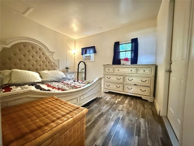 bedroom featuring attic access and dark wood finished floors