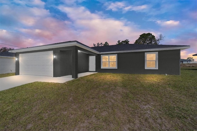 10374 SE 126th Ln, Belleview, FL 34420 - view of front of property featuring concrete driveway, an attached garage, a front yard, and stucco siding