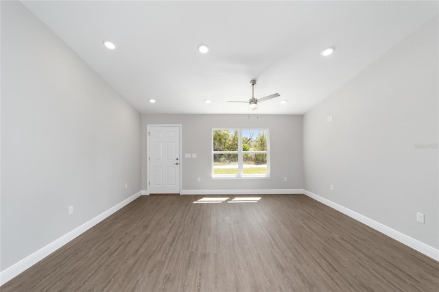 10374 SE 126th Ln, Belleview, FL 34420 - unfurnished living room with baseboards, dark wood-type flooring, ceiling fan, and recessed lighting