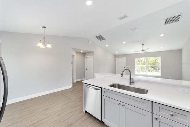 10374 SE 126th Ln, Belleview, FL 34420 - kitchen featuring a sink, light wood-style floors, light countertops, dishwasher, and visible vents