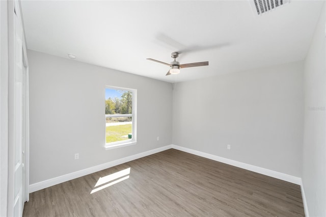 10374 SE 126th Ln, Belleview, FL 34420 - empty room with baseboards, a ceiling fan, wood finished floors, and visible vents