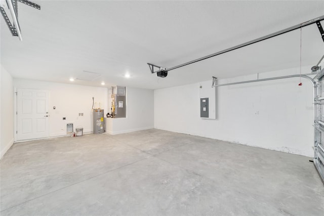 10374 SE 126th Ln, Belleview, FL 34420 - garage with heating unit, recessed lighting, a garage door opener, electric panel, and electric water heater