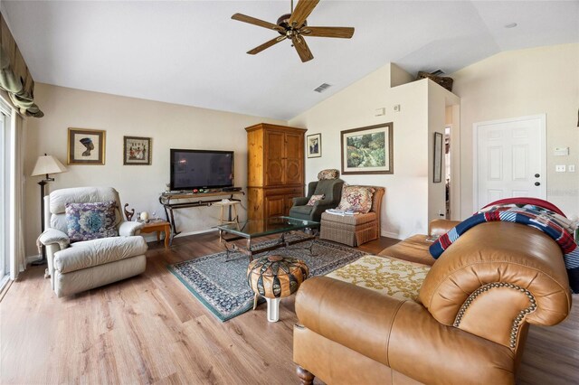 15426 SW 14th Avenue Rd, Ocala, FL 34473 - living room with light wood-style flooring, ceiling fan, vaulted ceiling, and visible vents