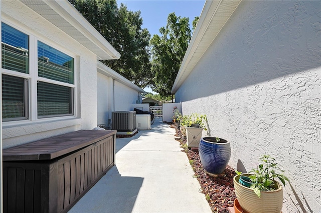 view of patio featuring fence and cooling unit