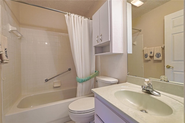 bathroom featuring toilet, shower / tub combo with curtain, vanity, and a textured ceiling