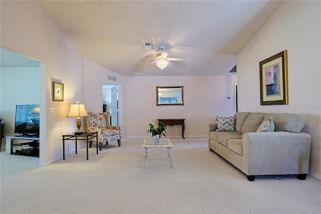carpeted living room featuring ceiling fan, baseboards, and visible vents