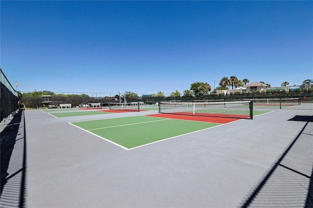 view of sport court featuring fence