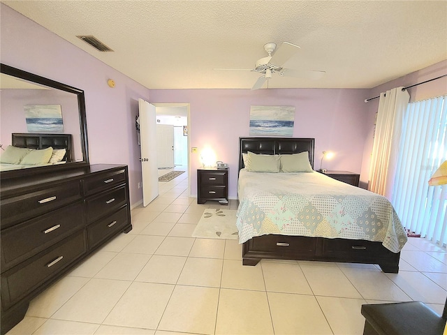 5606 SW 107th St, Ocala, FL 34476 - bedroom featuring visible vents, a ceiling fan, light tile patterned flooring, and a textured ceiling