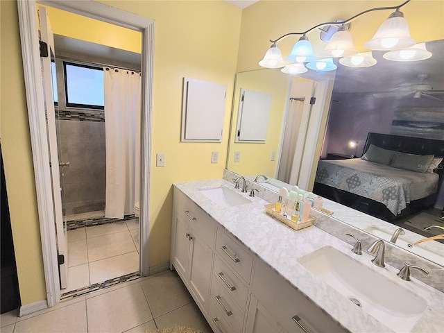 5606 SW 107th St, Ocala, FL 34476 - ensuite bathroom featuring tile patterned floors, double vanity, a shower with curtain, and a sink