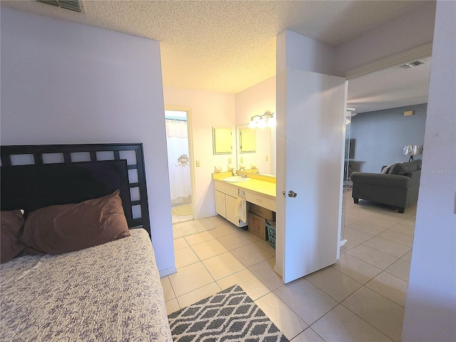 5606 SW 107th St, Ocala, FL 34476 - full bathroom featuring visible vents, a textured ceiling, tile patterned flooring, and vanity