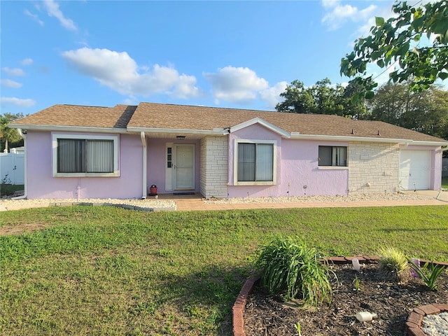 5606 SW 107th St, Ocala, FL 34476 - ranch-style house with an attached garage, a front yard, and stucco siding