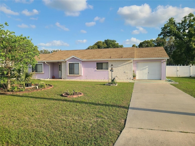 5606 SW 107th St, Ocala, FL 34476 - single story home with a front yard, an attached garage, fence, stucco siding, and driveway