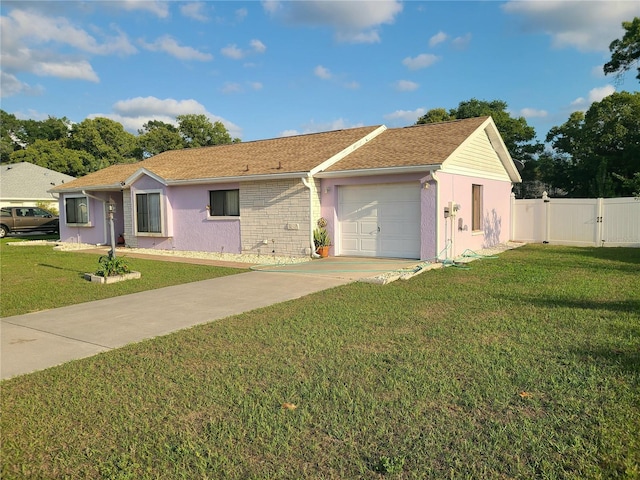 5606 SW 107th St, Ocala, FL 34476 - single story home featuring a front yard, fence, a gate, an attached garage, and concrete driveway