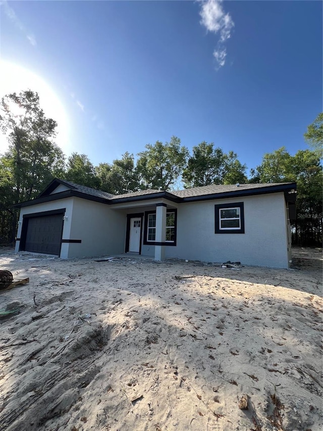 1581 W Saint Elizabeth Pl, Citrus Springs, FL 34434 - ranch-style home with an attached garage and stucco siding
