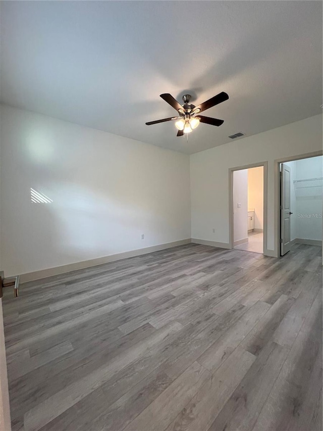 1581 W Saint Elizabeth Pl, Citrus Springs, FL 34434 - unfurnished bedroom featuring visible vents, ceiling fan, light wood-style flooring, and baseboards