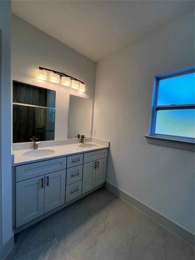1581 W Saint Elizabeth Pl, Citrus Springs, FL 34434 - bathroom with a shower stall, marble finish floor, double vanity, and a sink