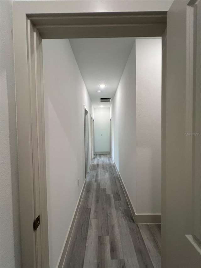 1581 W Saint Elizabeth Pl, Citrus Springs, FL 34434 - hall featuring recessed lighting, visible vents, wood finished floors, and baseboards