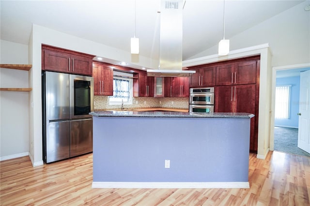 kitchen with appliances with stainless steel finishes, dark brown cabinets, light wood-style flooring, and a sink