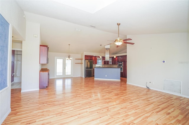 unfurnished living room with high vaulted ceiling, a ceiling fan, visible vents, light wood-style flooring, and baseboards