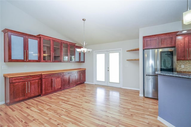 kitchen featuring pendant lighting, light wood-style floors, french doors, smart refrigerator, and a notable chandelier