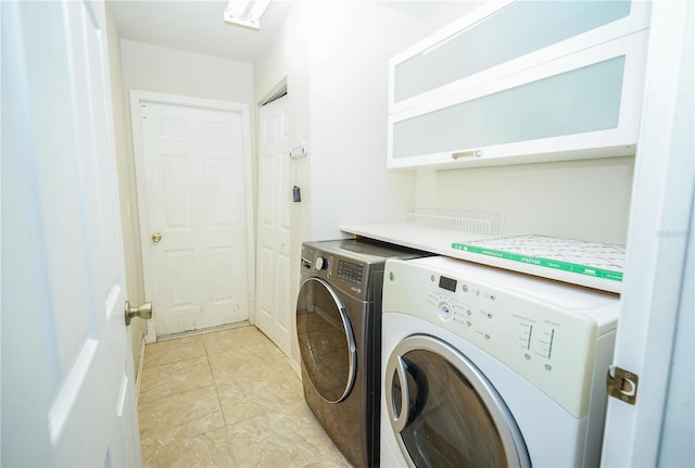 laundry room with washer and dryer and laundry area