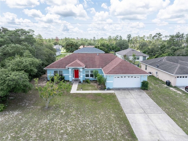 2730 SW 162nd Street Rd, Ocala, FL 34473 - single story home featuring an attached garage, concrete driveway, a front lawn, and roof with shingles