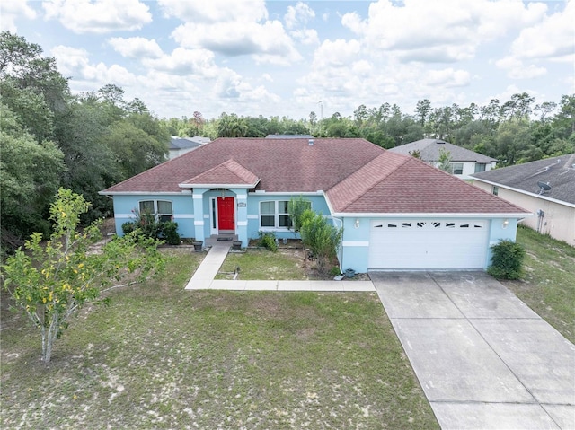 2730 SW 162nd Street Rd, Ocala, FL 34473 - view of front of home featuring a garage, stucco siding, a front lawn, concrete driveway, and roof with shingles