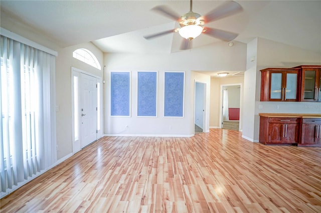 2730 SW 162nd Street Rd, Ocala, FL 34473 - unfurnished living room with vaulted ceiling, light wood-type flooring, and ceiling fan